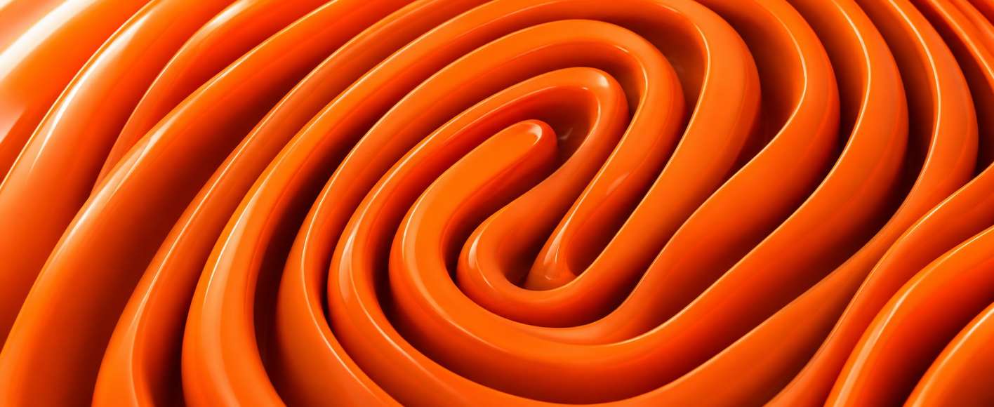 Glossy orange tubes coiled into a fingerprint pattern