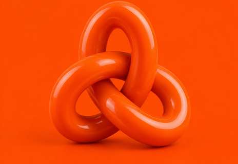 A glossy orange knot on an orange background